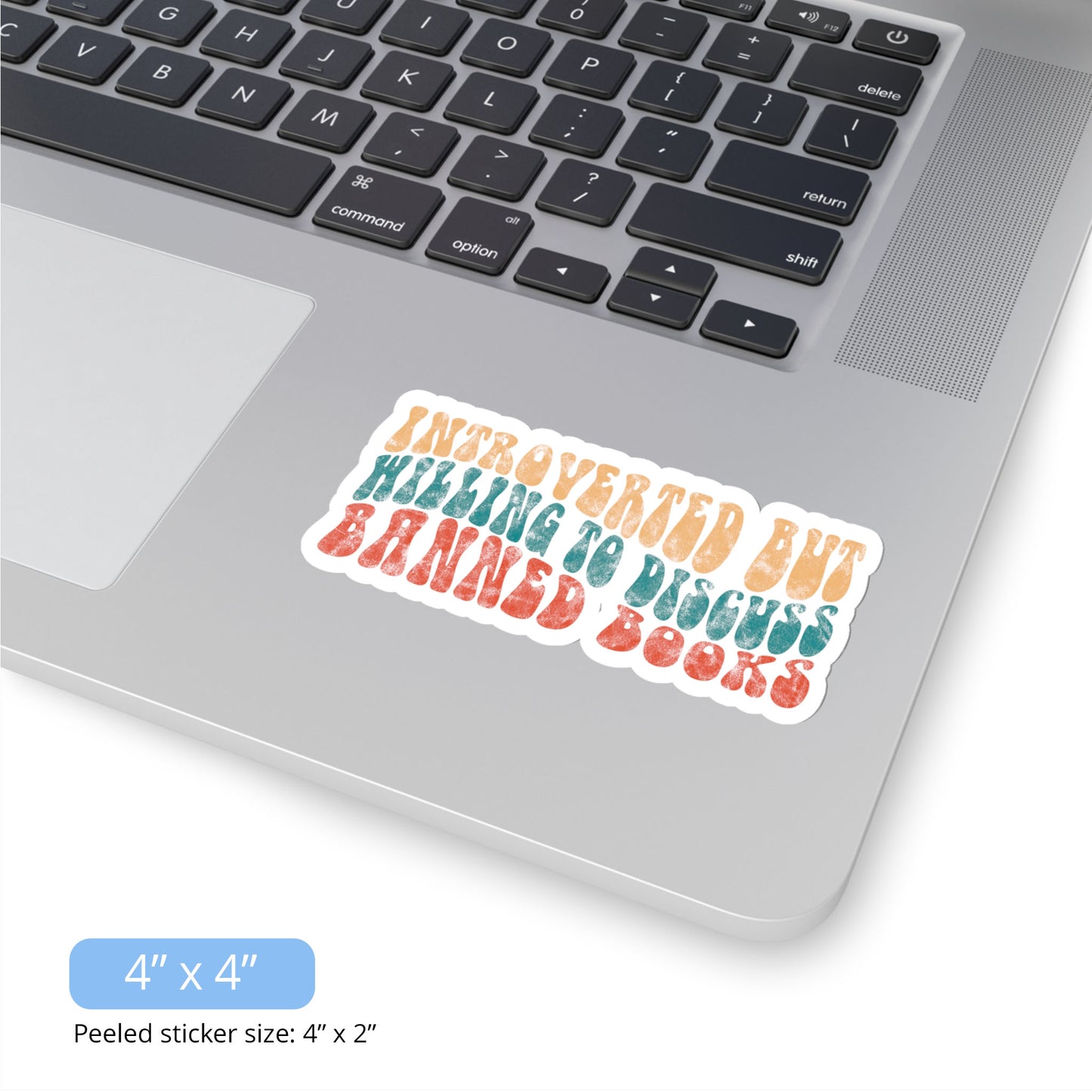 Contextual photo of the 4x4 inch (6x2.6” peeled) kiss-cut sticker that says “Introverted but willing to discuss banned books” in a retro, 1970s bubble font. Each line is a different color. The graphic is slightly distressed.