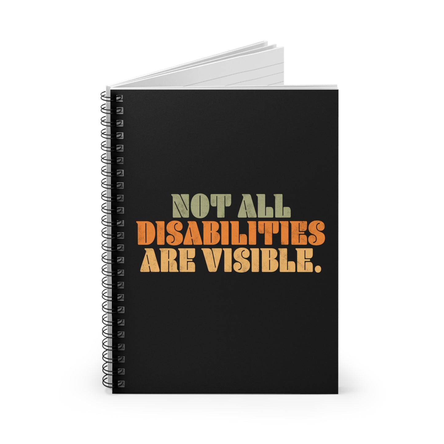 A black spiral notebook that says, “Not all disabilities are visible” in a thick, retro font in all caps. Each line is a different color. “Not all” is light green, “disabilities” is orange, and “are visible” is yellow. The graphic has a retro look and is slightly distressed. The mug is on a table with a spoon and a cookie.