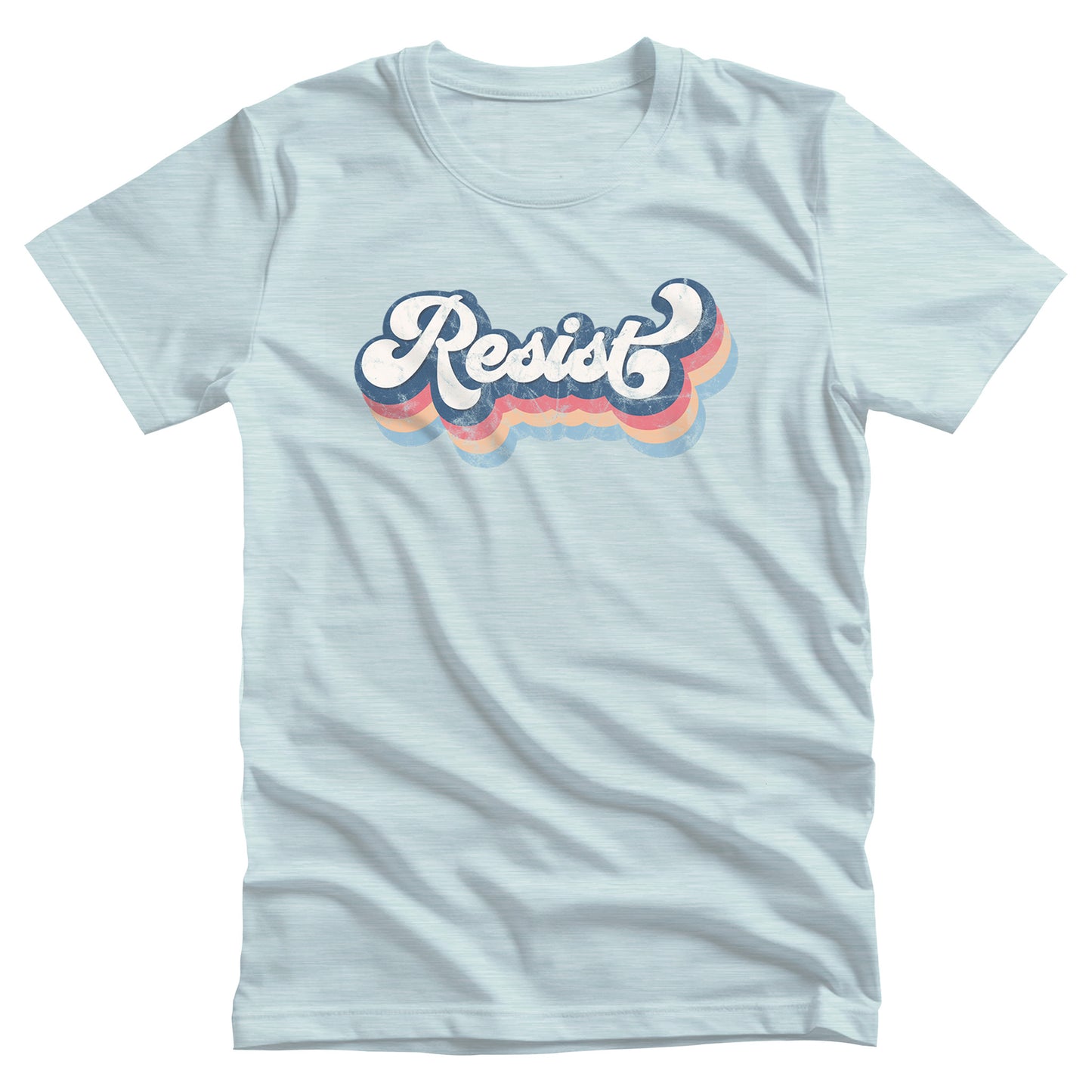 Heather Ice Blue color unisex t-shirt that says, “Resist” in a script font and is thickly outlined with four colors that have been shifted downward to give it a retro feel. The colors are dark blue, dark pink, beige, and light blue.