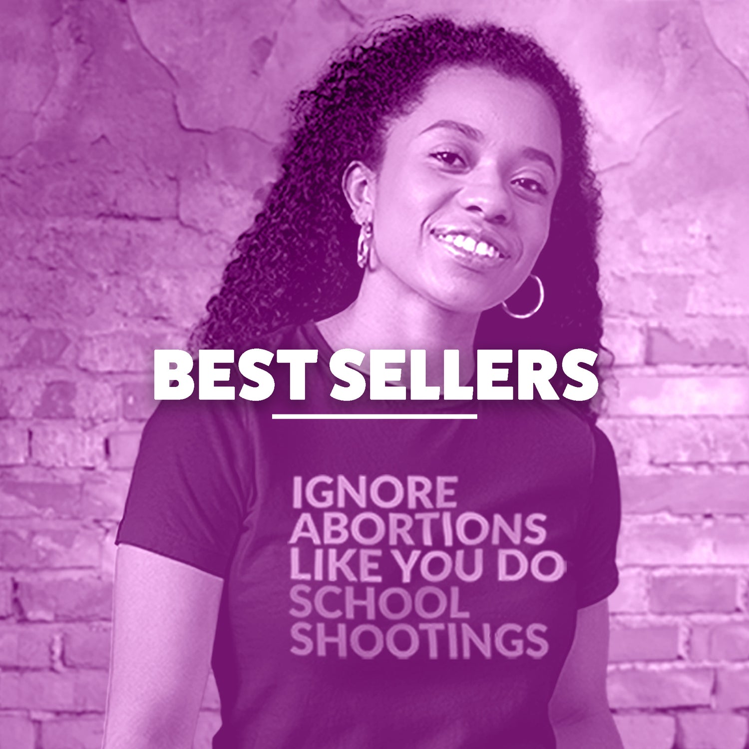 A woman of color is wearing a shirt that says “Ignore Aboritons Like You Do School Shootings.” This image is for our Best Sellers Collection.