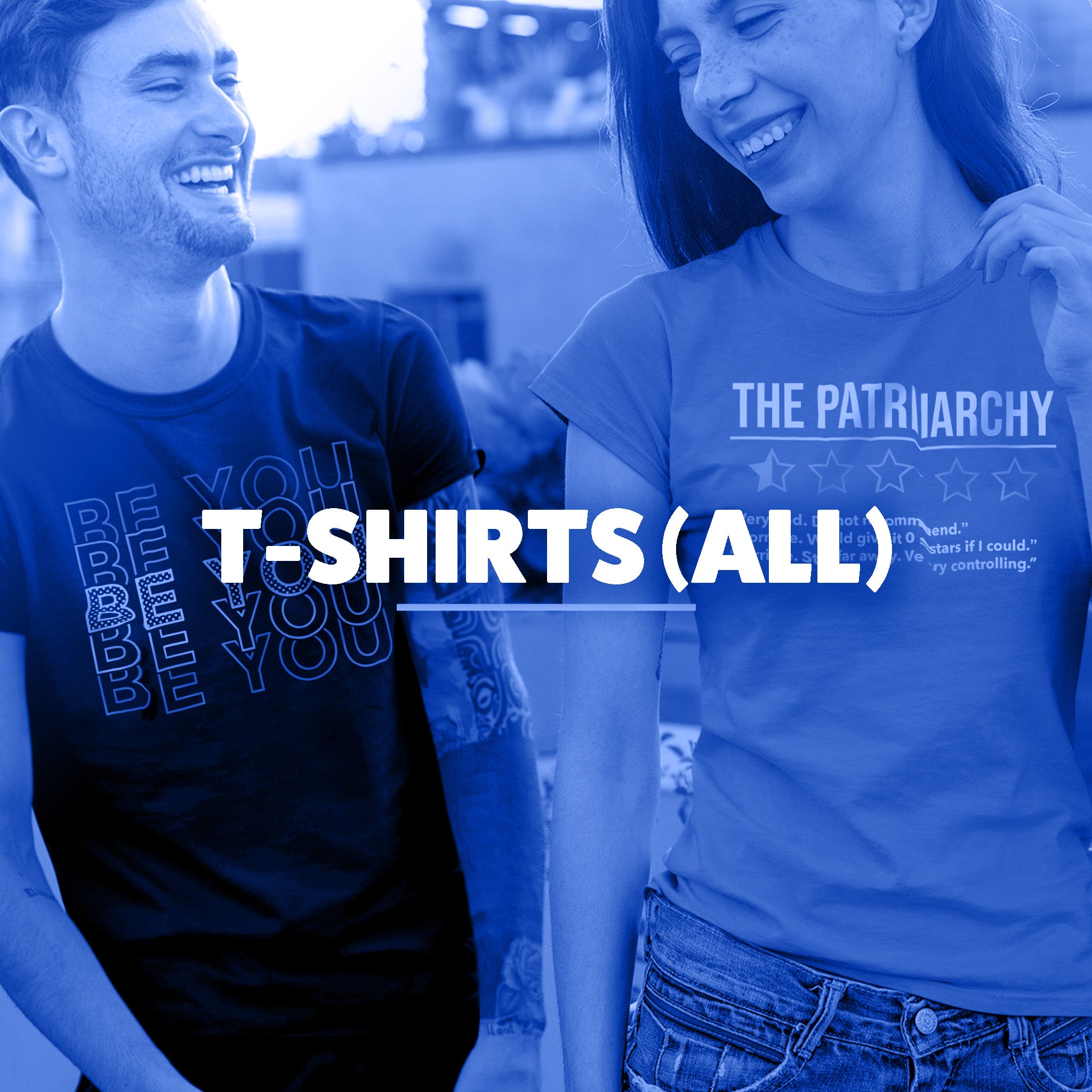 An image of a man and a woman standing together. The man is wearing a t-shirt that says 