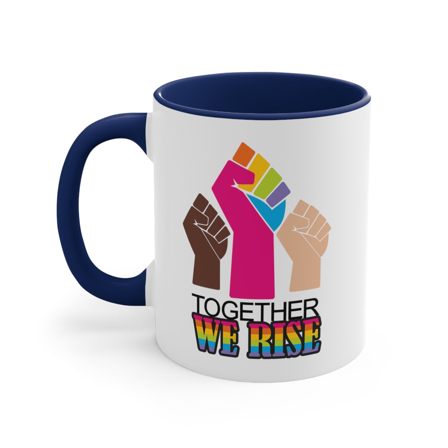 Navy Blue accented 11oz ceramic mug ]with a graphic a brown skin-colored fist on the left, a rainbow fist front and center, and a white skin-colored fist on the right. Below that reads “Together We Rise.” “Together” is on one line and “We Rise” is below that in rainbow colors. The inside of the mug and the handle are both navy blue.