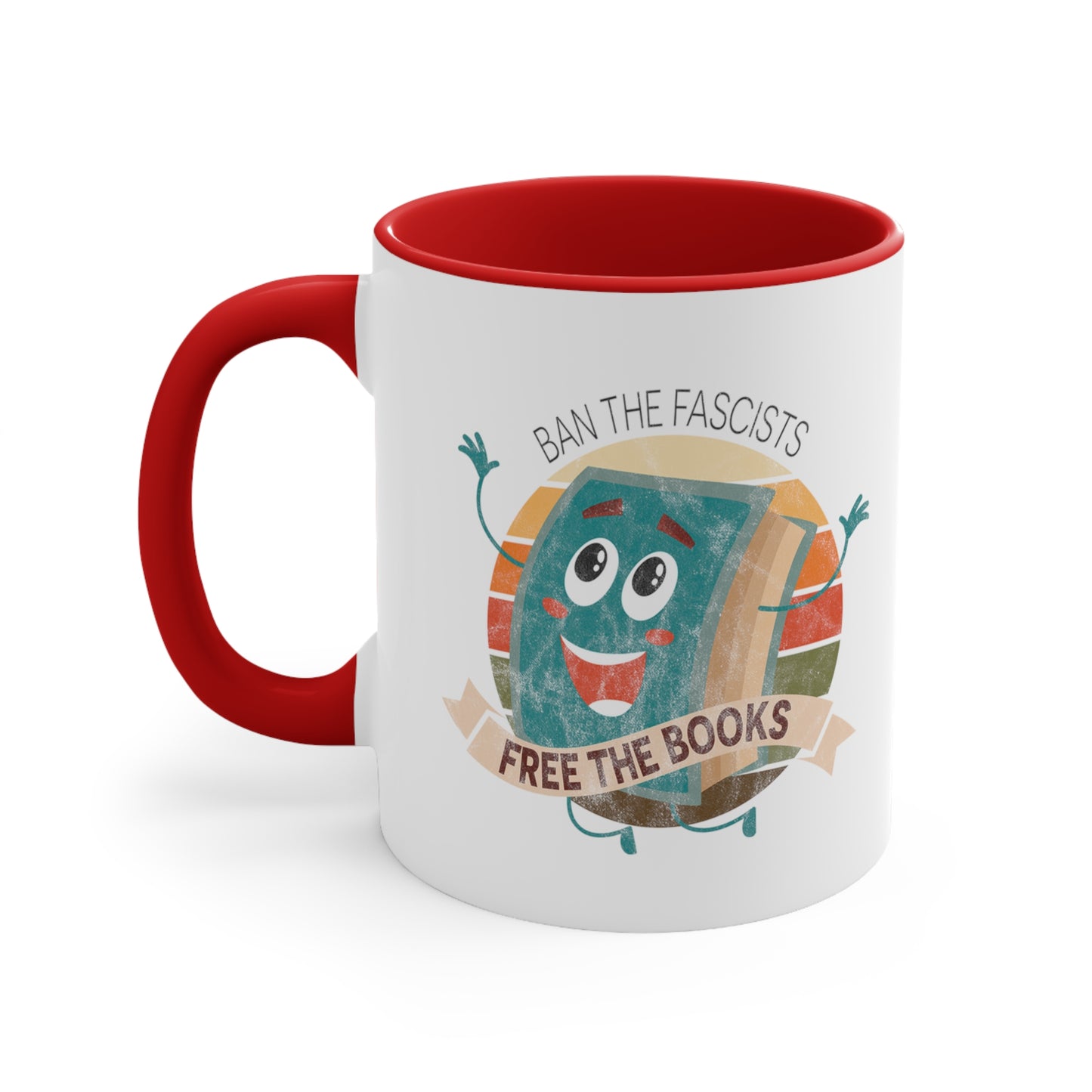 Mug with a red handle and interior with a graphic that says “Ban the Fascists, Free the Books” with a vintage illustration of a cartoon book leaping for joy. There is a circle of vintage-colored stripes behind it. 