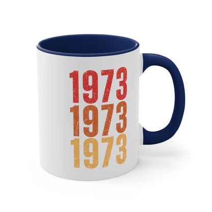 11oz ceramic mug with a navy interior and handle featuring retro-inspired colors and slight distressing, repeated three times in distinct rows.