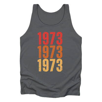 Asphalt color vintage-style unisex tank top with ‘1973” on the front, featuring retro-inspired colors and slight distressing, repeated three times in distinct rows.