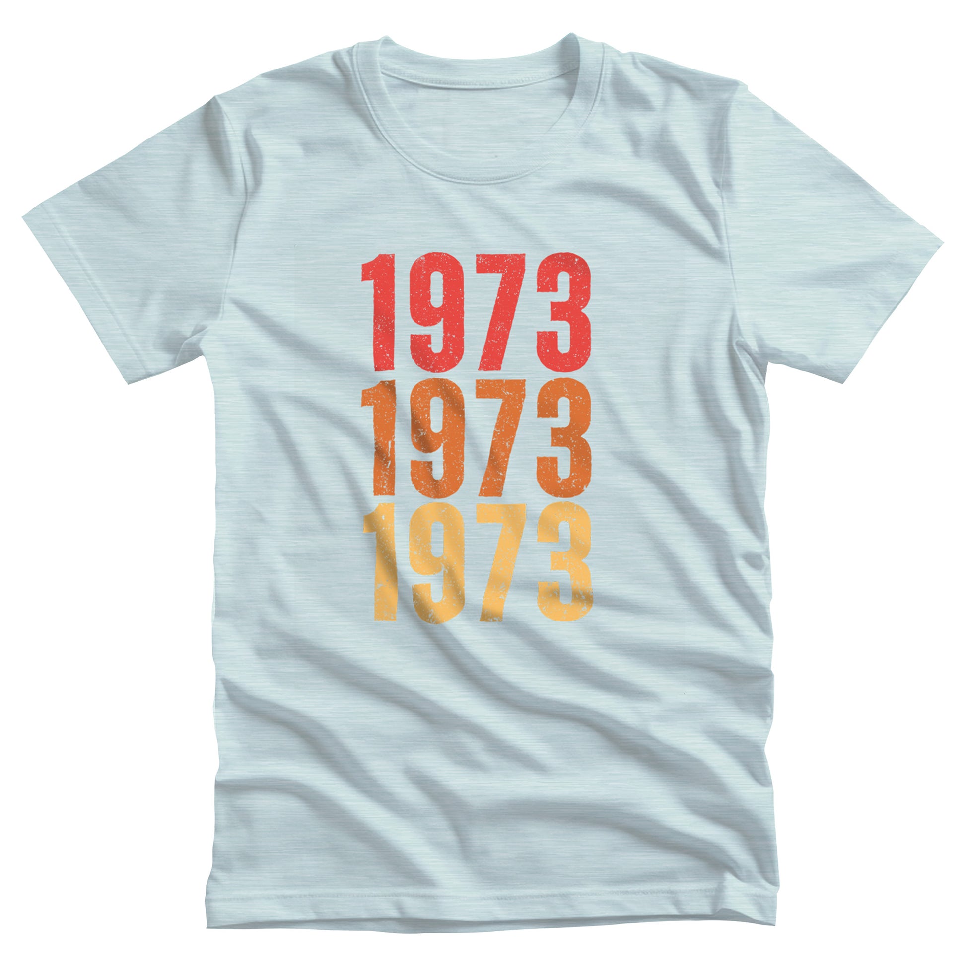 Heather Ice Blue color vintage-style unisex t-shirt with ‘1973” on the front, featuring retro-inspired colors and slight distressing, repeated three times in distinct rows.