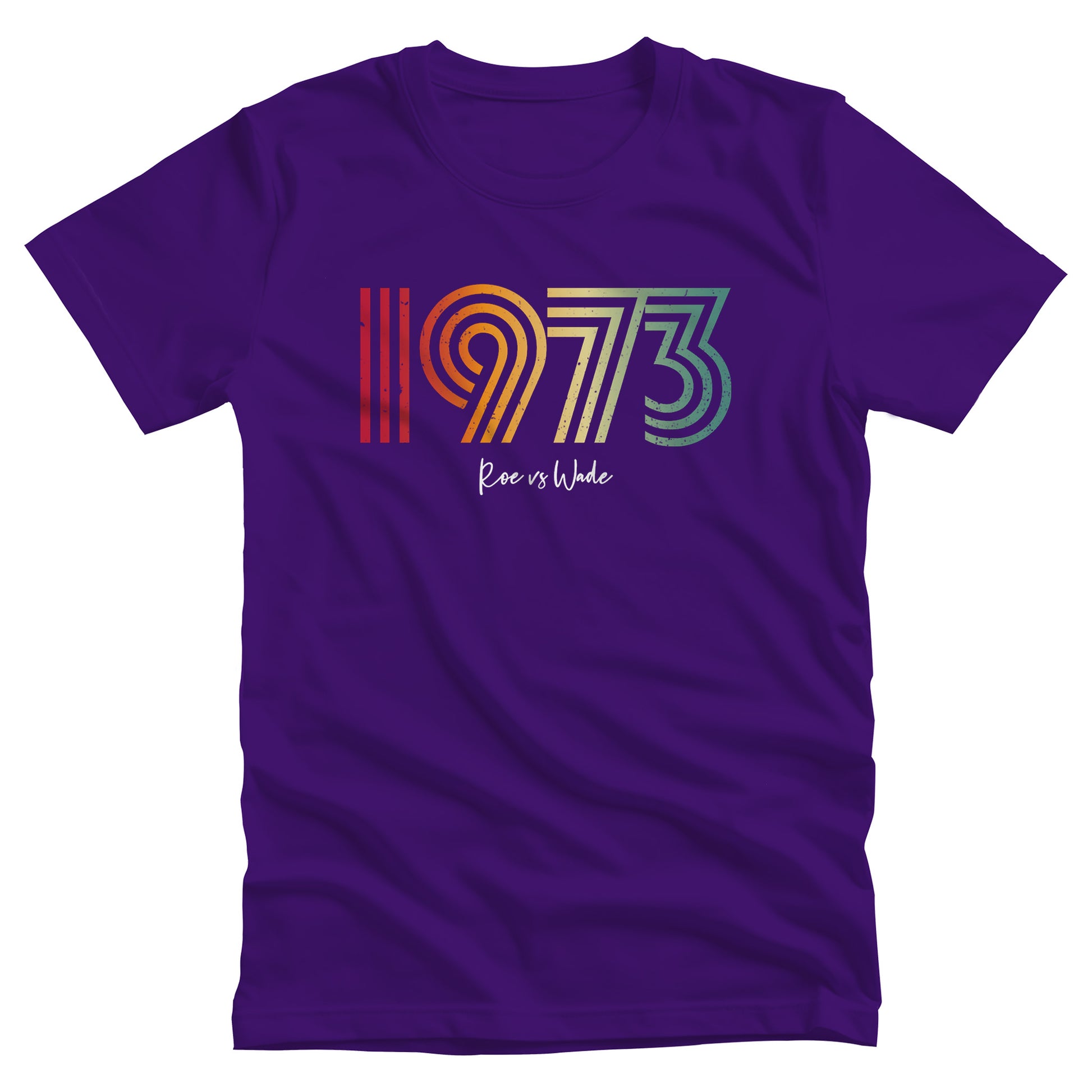 Team Purple color unisex t-shirt that says, “1973 Roe vs Wade.” The numbers are in a round, lined retro font in a rainbow-gradient color. “Roe vs Wade” is beneath it in a script font.