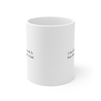 White ceramic mug with the handle facing the back that reads "I don't know who needs to hear this but fascism is bad." The text is written in a handwritten font.