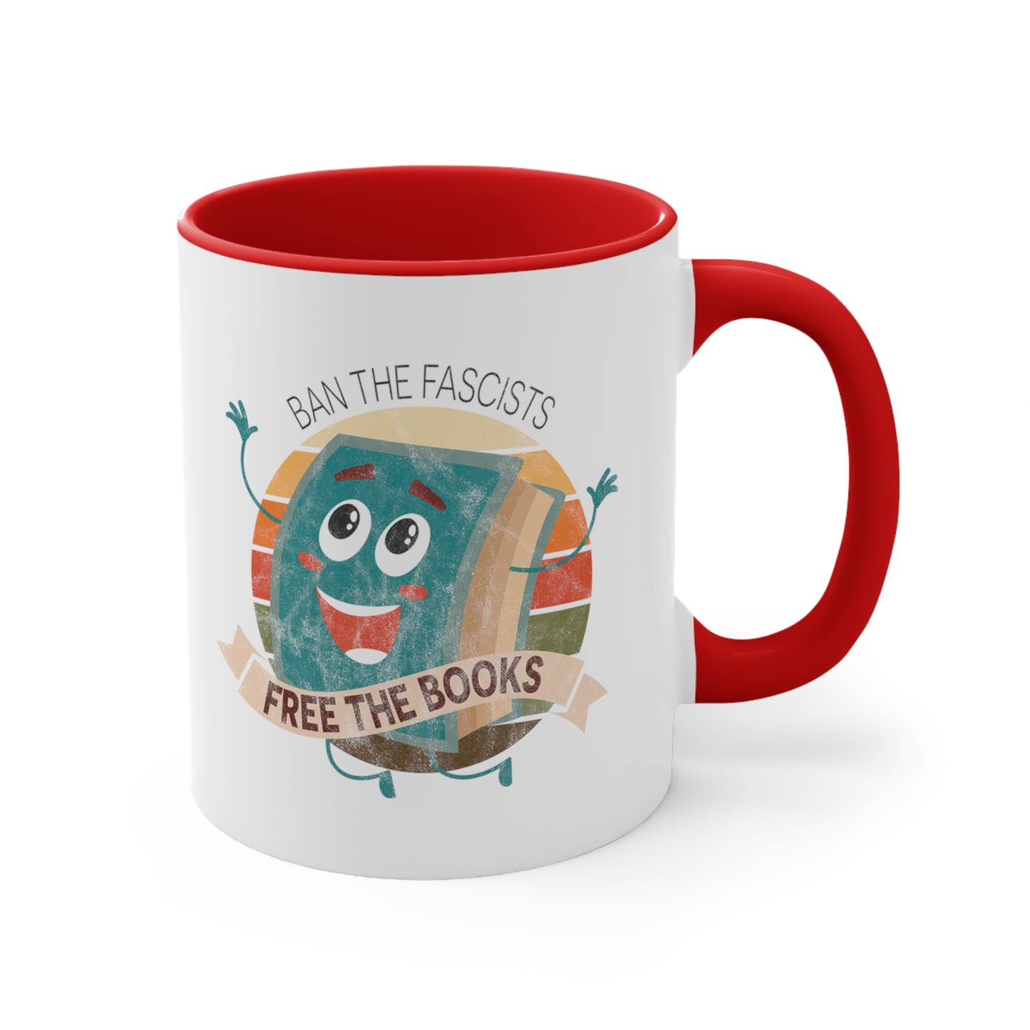 Mug with a red handle and interior with a graphic that says “Ban the Fascists, Free the Books” with a vintage illustration of a cartoon book leaping for joy. There is a circle of vintage-colored stripes behind it. 