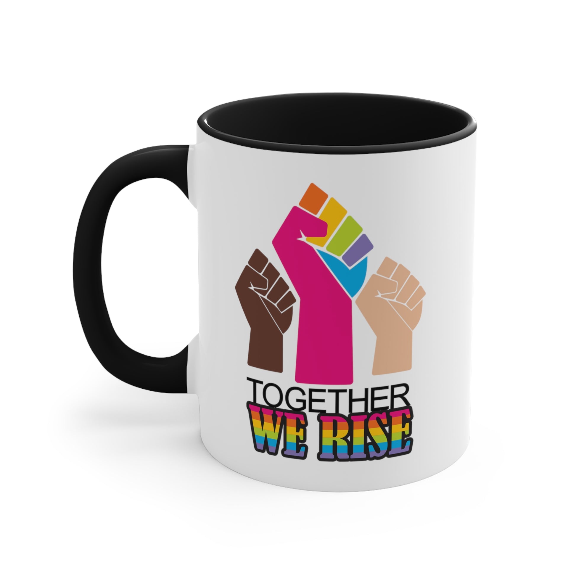 Black accented 11oz ceramic mug ]with a graphic a brown skin-colored fist on the left, a rainbow fist front and center, and a white skin-colored fist on the right. Below that reads “Together We Rise.” “Together” is on one line and “We Rise” is below that in rainbow colors. The inside of the mug and the handle are both black.