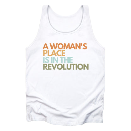 White unisex tank top that says “A woman’s place is in the revolution” in a round, modern font in all caps and left aligned. Each line is a different color. “A Woman’s” is orange, “place” is yellow-orange, “is in the” is light blue, and “revolution” is military green.