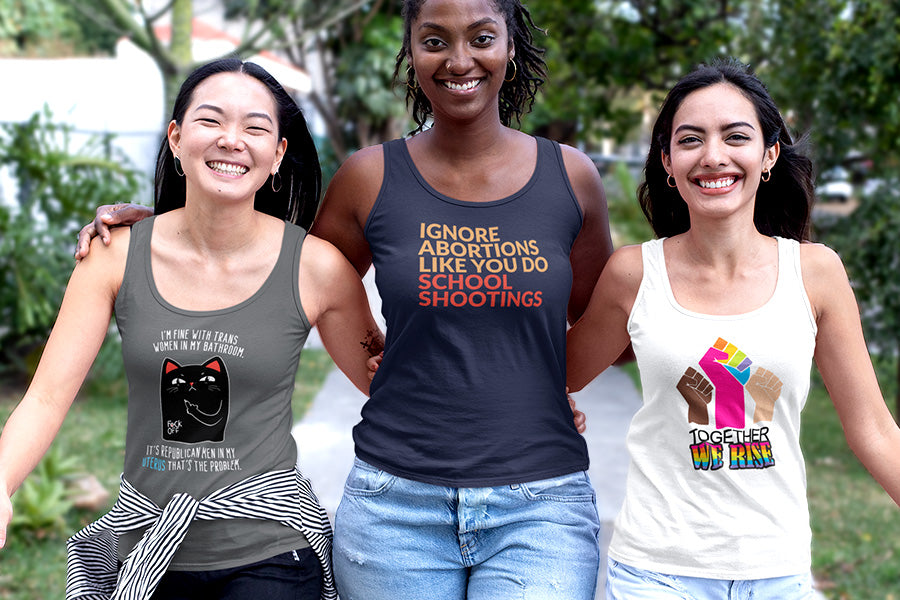 Three friends wearing antifascism tank tops.