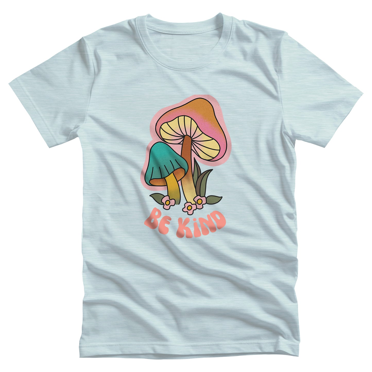 Heather Ice Blue color unisex t-shirt that says “Be Kind” in a retro font with two retro mushrooms above the text. The text is slightly arched down.