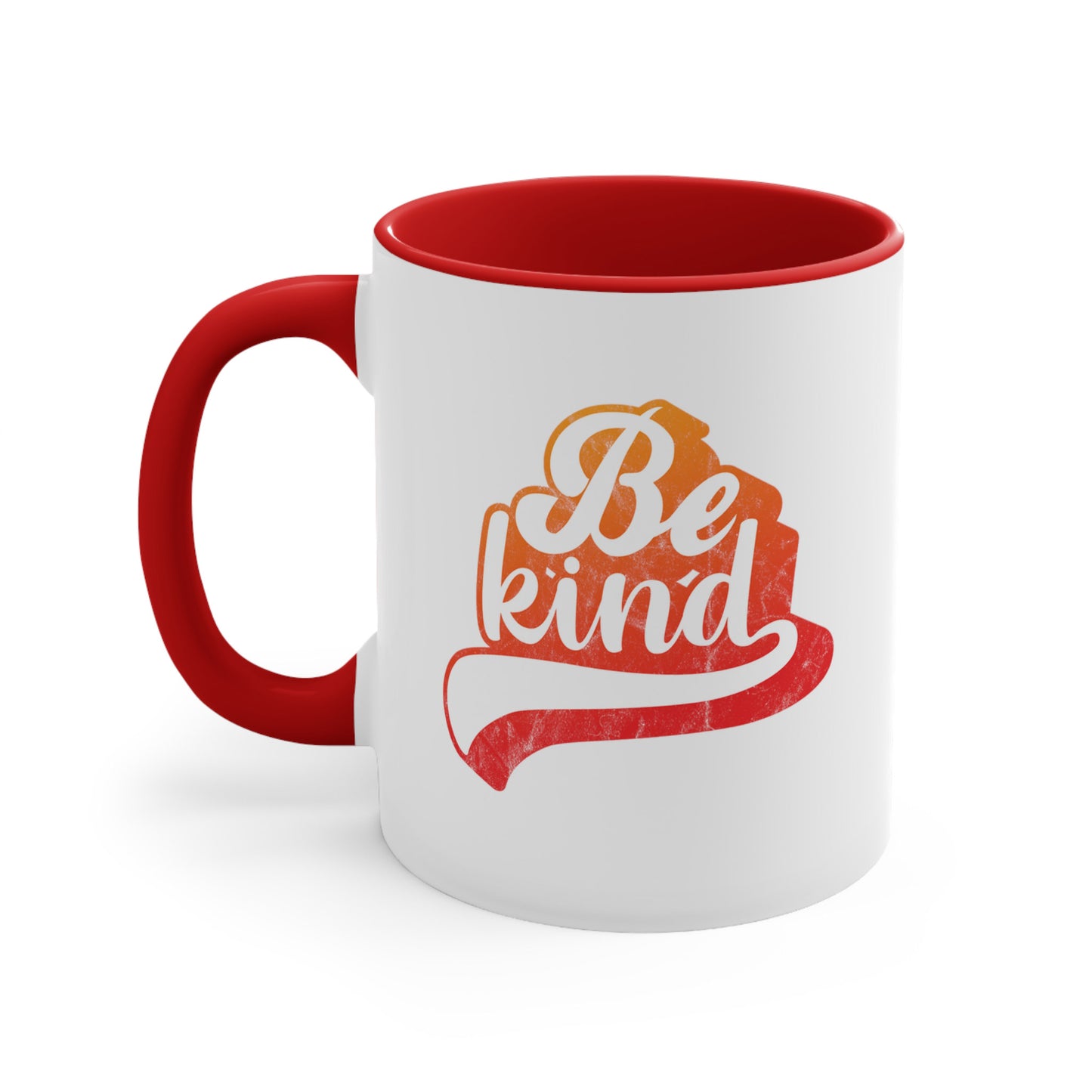 11oz ceramic mug with a red handle and interior that says, “Be Kind” in a script font that is an orange gradient color. The “d” has a unique swoosh glyph extending below the word, adding a dynamic and flowing aesthetic to the text.