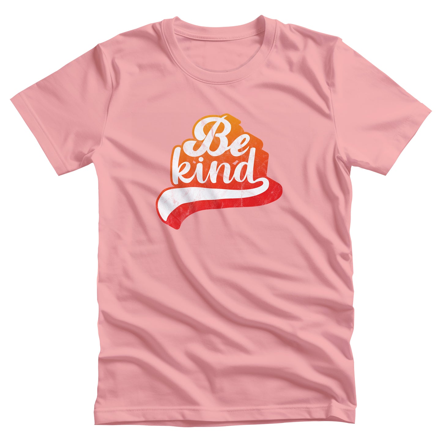 Pink unisex t-shirt that says, “Be Kind” in a script font that is an orange gradient color. The “d” has a unique swoosh glyph extending below the word, adding a dynamic and flowing aesthetic to the text.