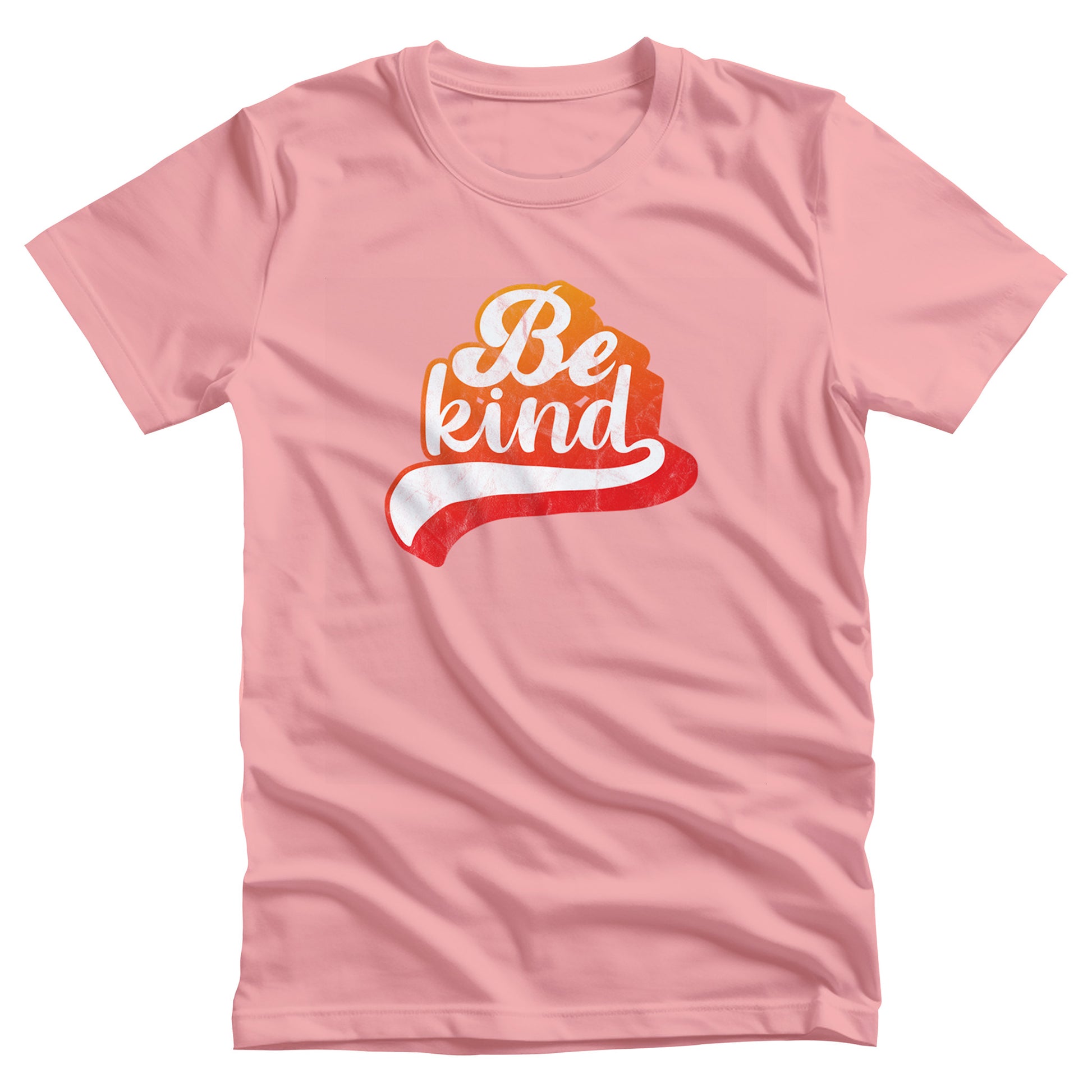 Pink unisex t-shirt that says, “Be Kind” in a script font that is an orange gradient color. The “d” has a unique swoosh glyph extending below the word, adding a dynamic and flowing aesthetic to the text.