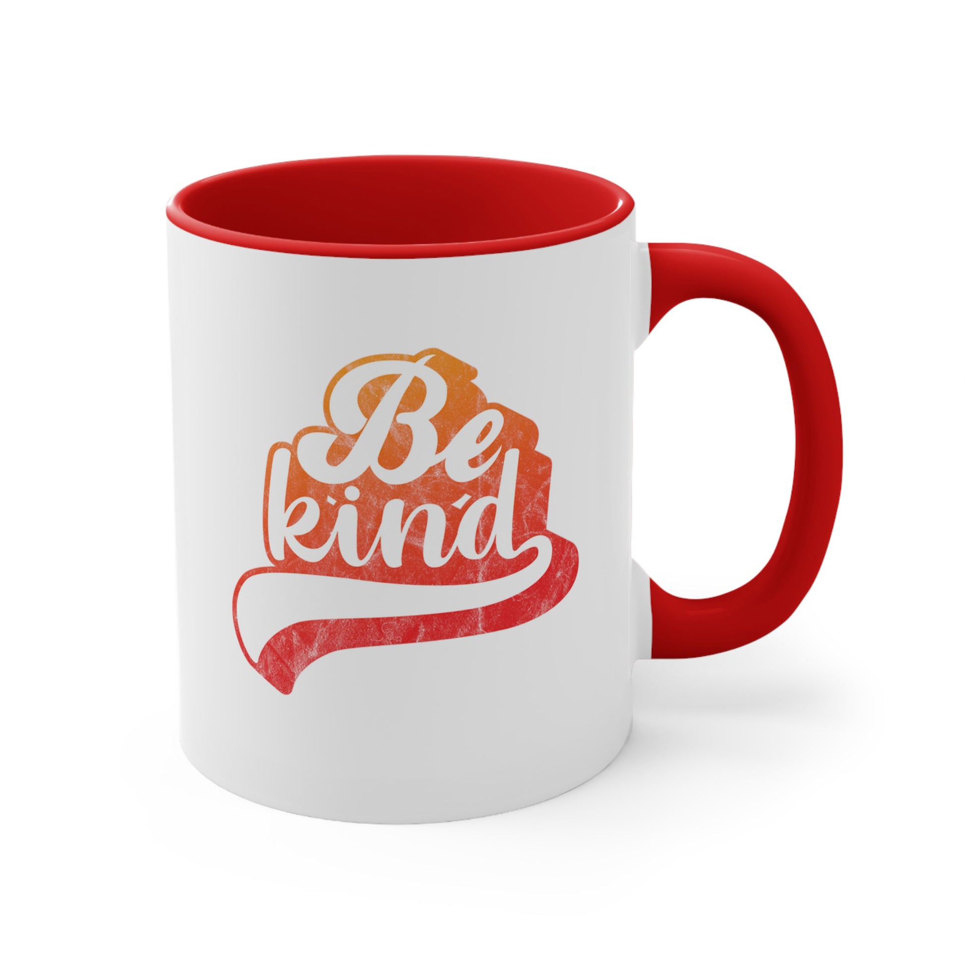 11oz ceramic mug with a red handle and interior that says, “Be Kind” in a script font that is an orange gradient color. The “d” has a unique swoosh glyph extending below the word, adding a dynamic and flowing aesthetic to the text.