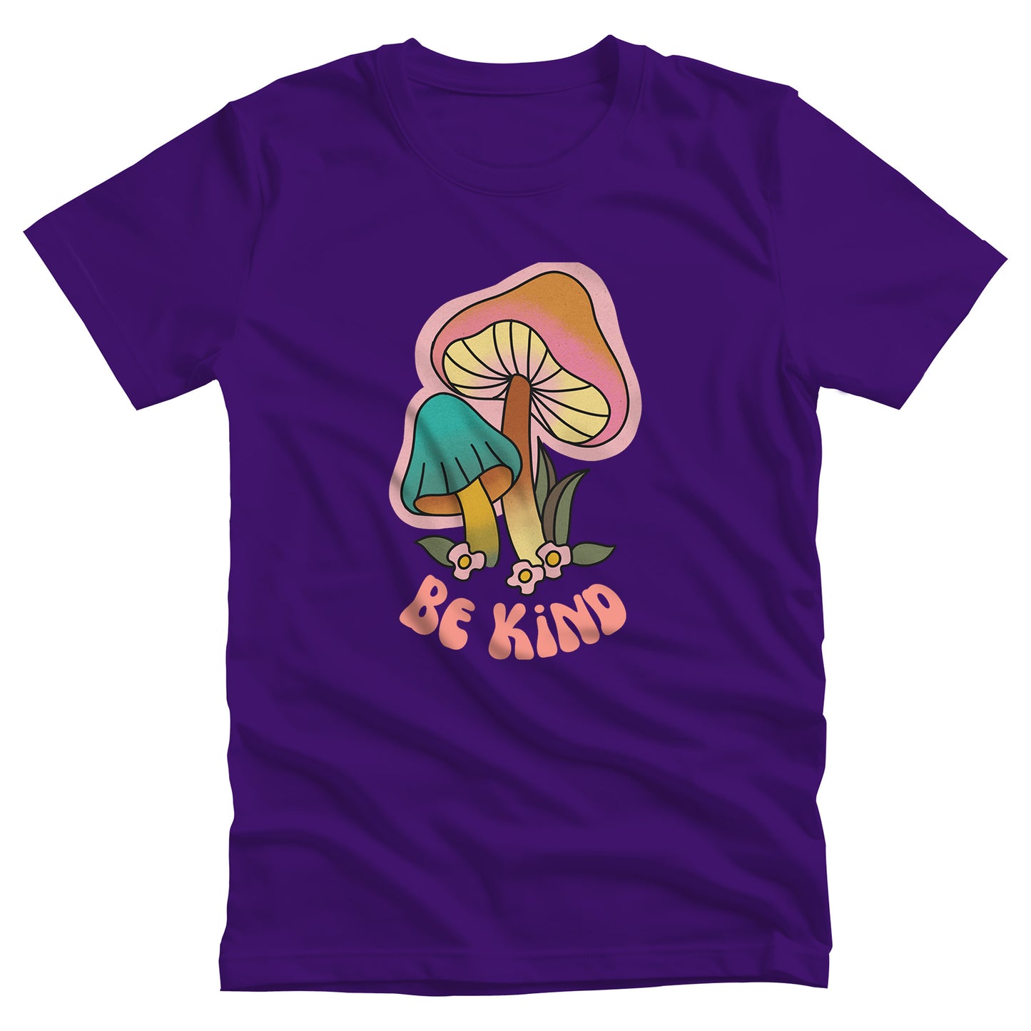 Team Purple color unisex t-shirt that says “Be Kind” in a retro font with two retro mushrooms above the text. The text is slightly arched down.