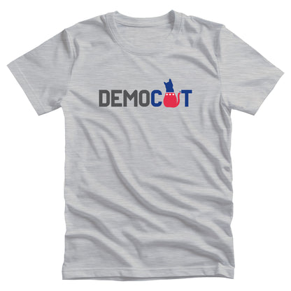 Athletic Heather color unisex t-shirt that says “DEMOCAT.” The “A” is an illustration of a cat that’s blue at the top and red at the bottom.