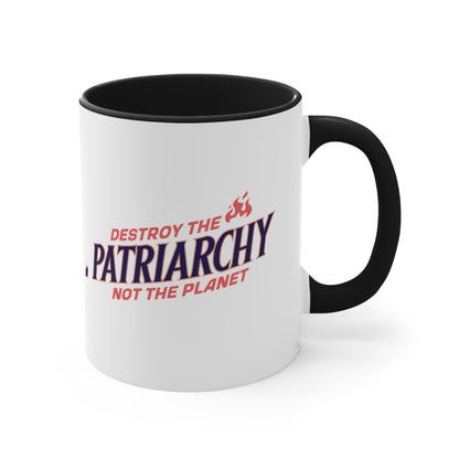 11oz ceramic mug with a black interior and handle with text: 'DESTROY THE PATRIARCHY NOT THE PLANET slanted upwards. 'DESTROY THE' is on the first line with small flames after it, 'PATRIARCHY' is on the second line, and 'NOT THE PLANET' is on the third line.