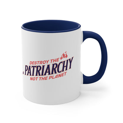 11oz ceramic mug with a navy interior and handle with text: 'DESTROY THE PATRIARCHY NOT THE PLANET slanted upwards. 'DESTROY THE' is on the first line with small flames after it, 'PATRIARCHY' is on the second line, and 'NOT THE PLANET' is on the third line.