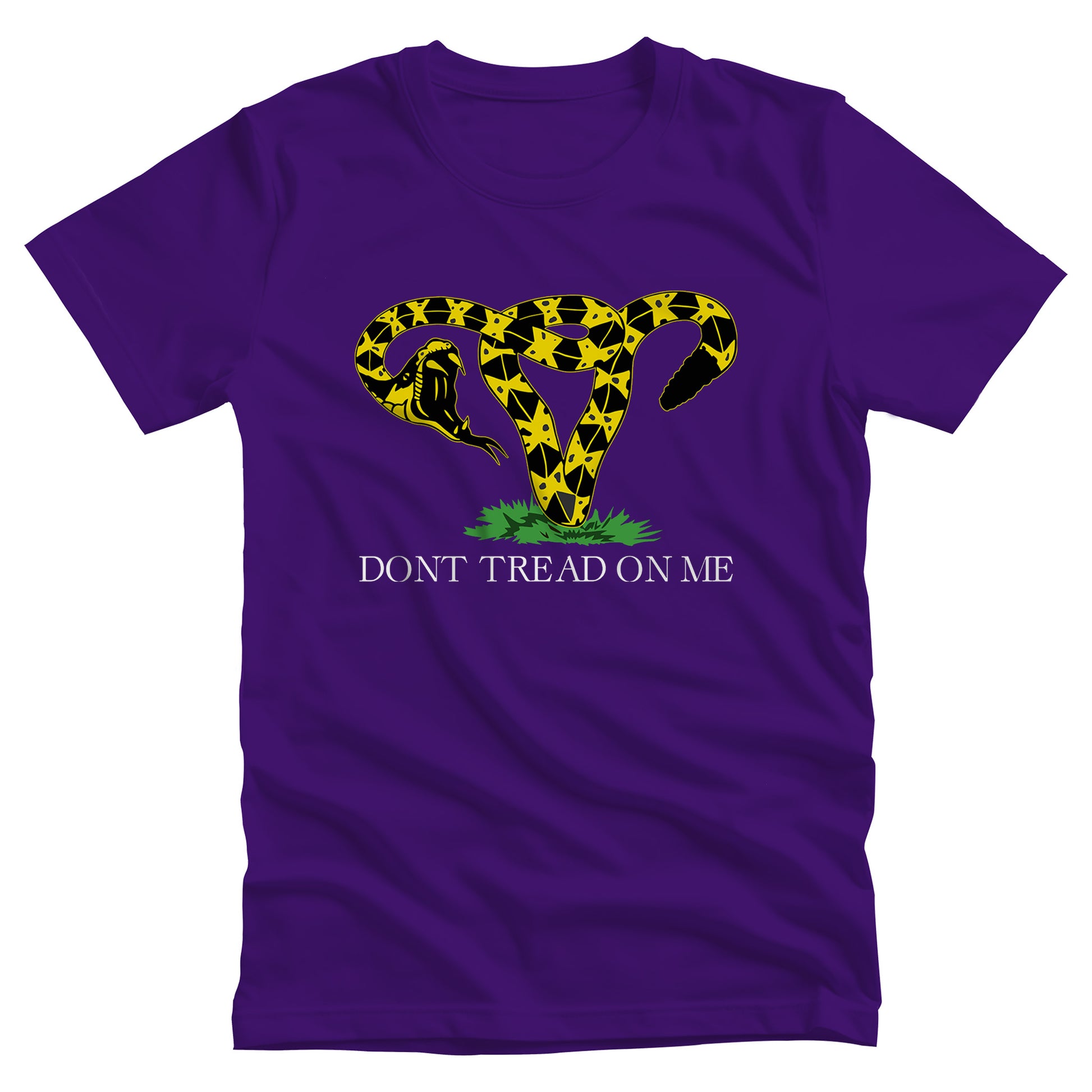 Team Purple color unisex t-shirt with an image of a rattlesnake coiled into the shape of a uterus. Its mouth is wide open ready to strike. Beneath the graphic, it says, “DONT TREAD ON ME” with no apostrophe in “DON’T” like the original.