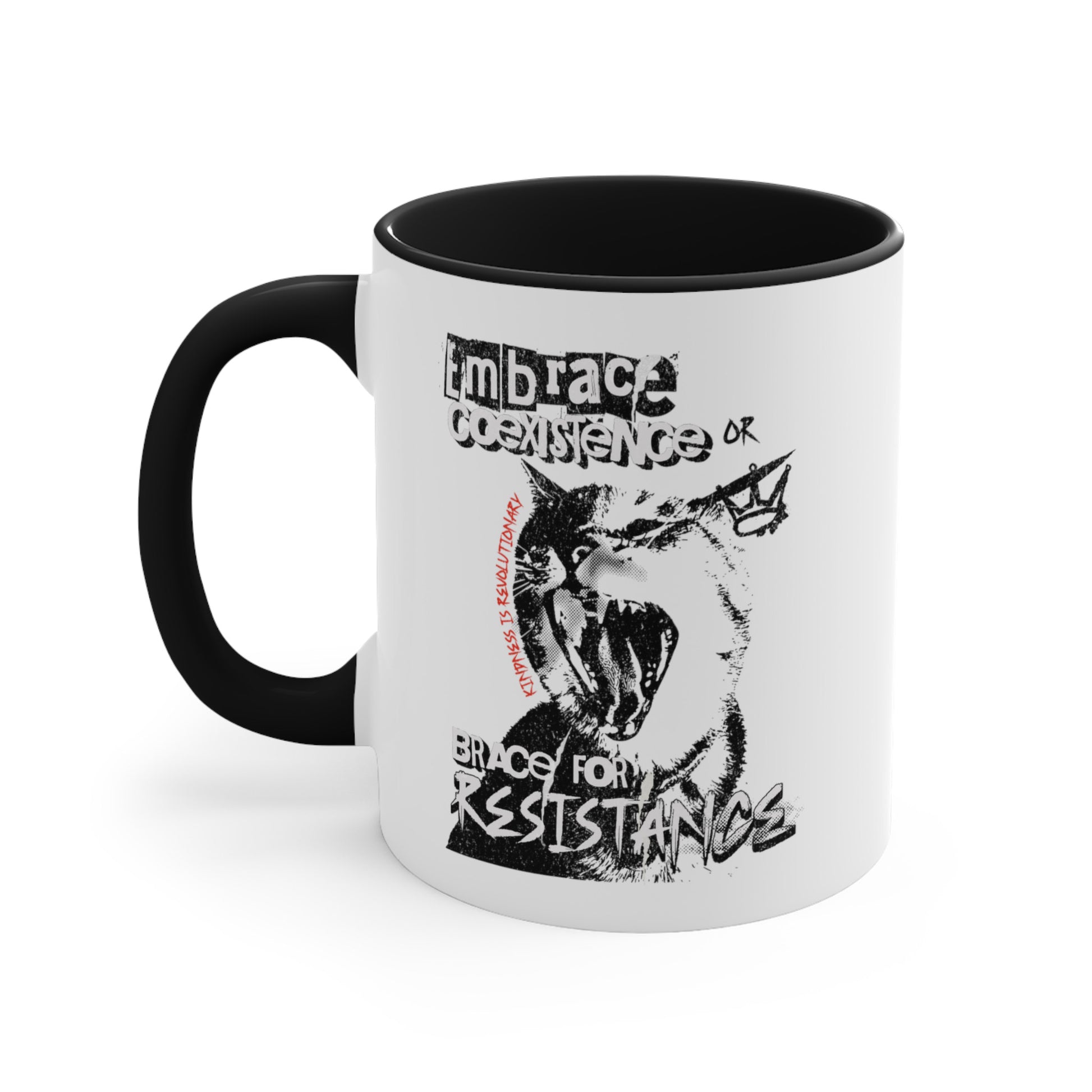 11oz ceramic mug with a black interior and handle featuring the phrase 'Embrace Coexistence or Brace for Resistance' in a grunge font. The shirt includes an illustration of a cat meowing loudly with a small crown to the right, adding to the grunge aesthetic. Small red letters along the left side of the cat's face, written vertically say, ‘Kindness is revolutionary' in all caps.