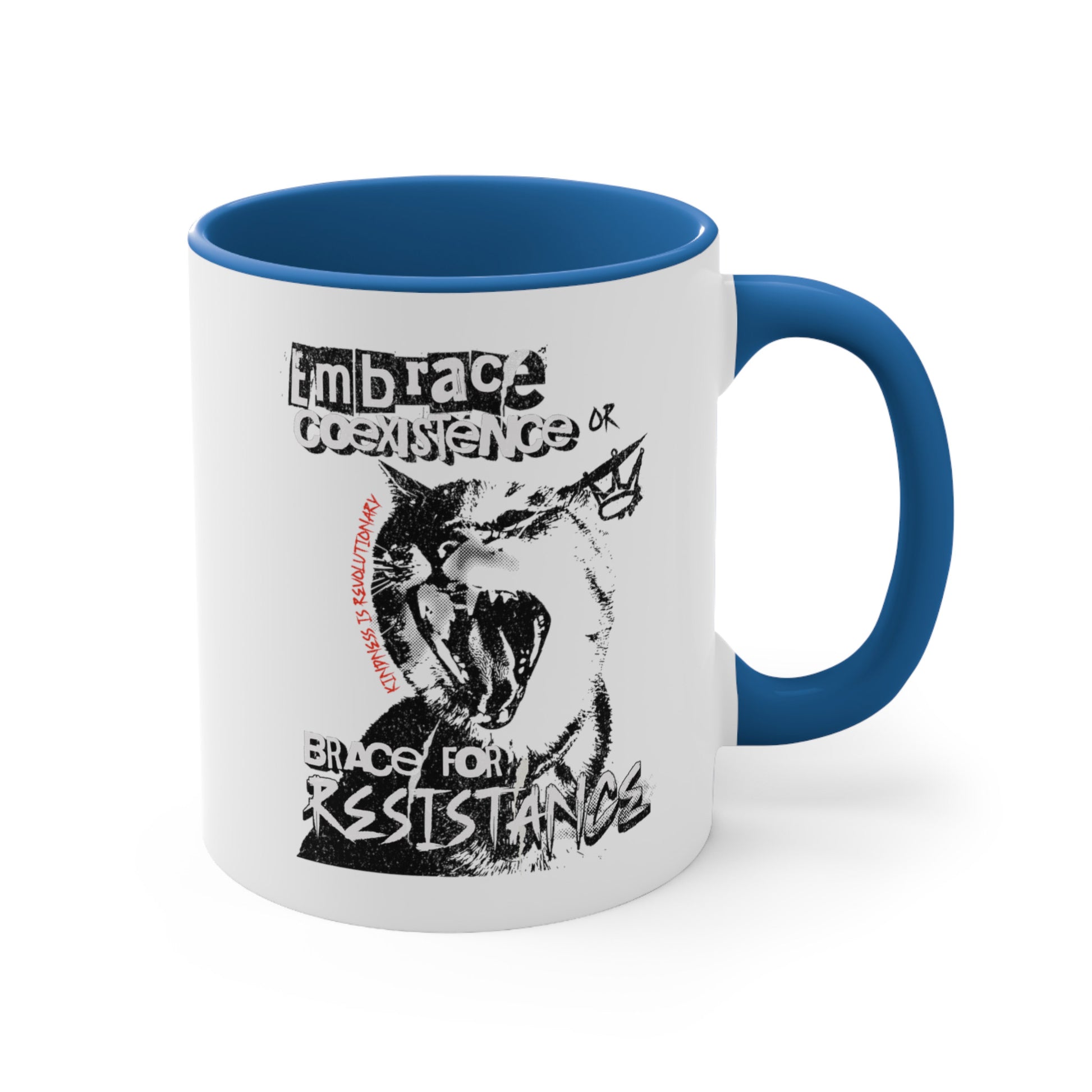 11oz ceramic mug with a blue interior and handle featuring the phrase 'Embrace Coexistence or Brace for Resistance' in a grunge font. The shirt includes an illustration of a cat meowing loudly with a small crown to the right, adding to the grunge aesthetic. Small red letters along the left side of the cat's face, written vertically say, ‘Kindness is revolutionary' in all caps.