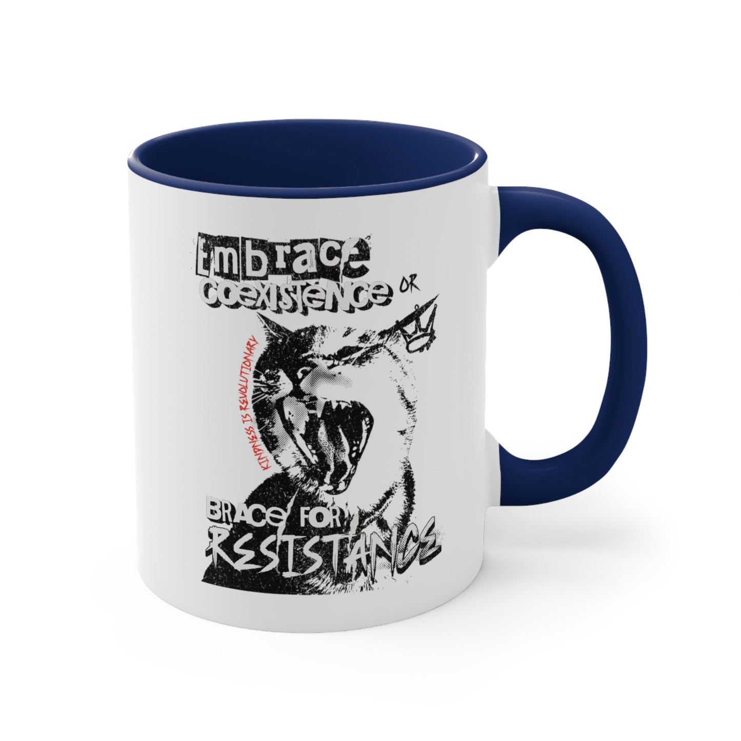 11oz ceramic mug with a navy blue interior and handle featuring the phrase 'Embrace Coexistence or Brace for Resistance' in a grunge font. The shirt includes an illustration of a cat meowing loudly with a small crown to the right, adding to the grunge aesthetic. Small red letters along the left side of the cat's face, written vertically say, ‘Kindness is revolutionary' in all caps.