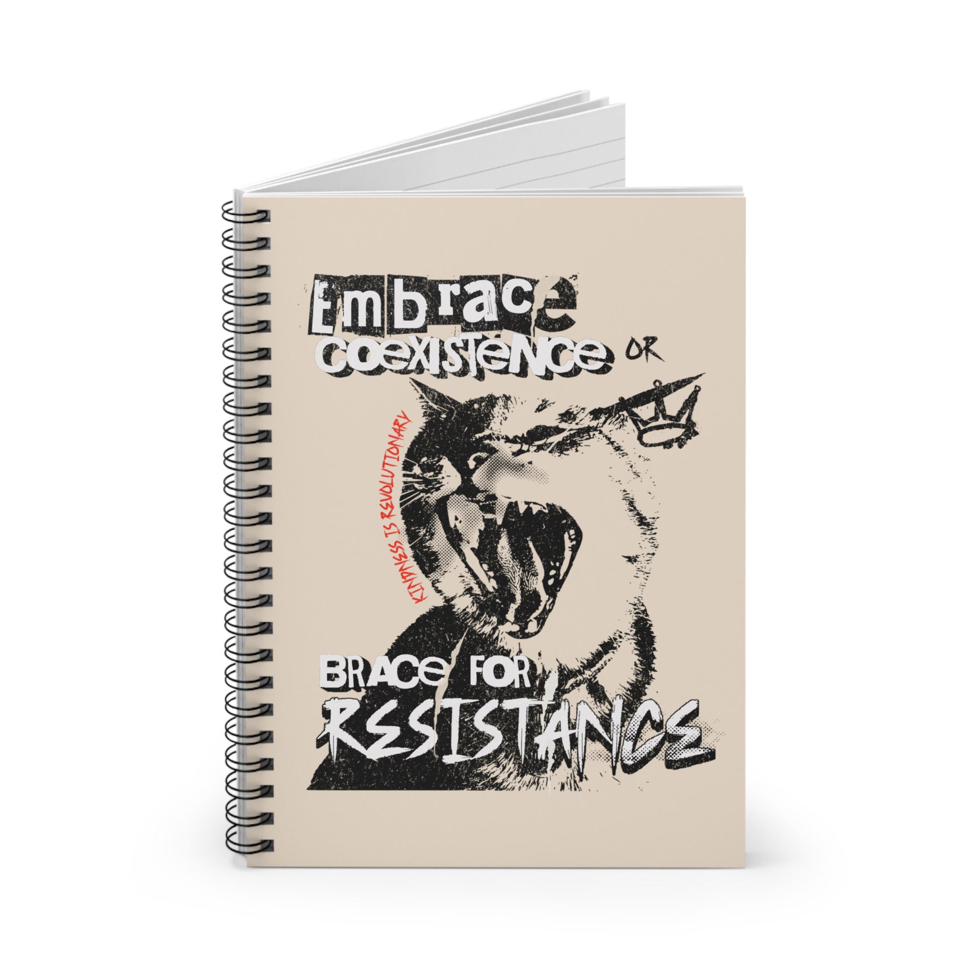 A 118-page spiral-bound notebook with a beige cover featuring the phrase 'Embrace Coexistence or Brace for Resistance' in a grunge font. The shirt includes an illustration of a cat meowing loudly with a small crown to the right, adding to the grunge aesthetic. Small red letters along the left side of the cat's face, written vertically say, ‘Kindness is revolutionary' in all caps.