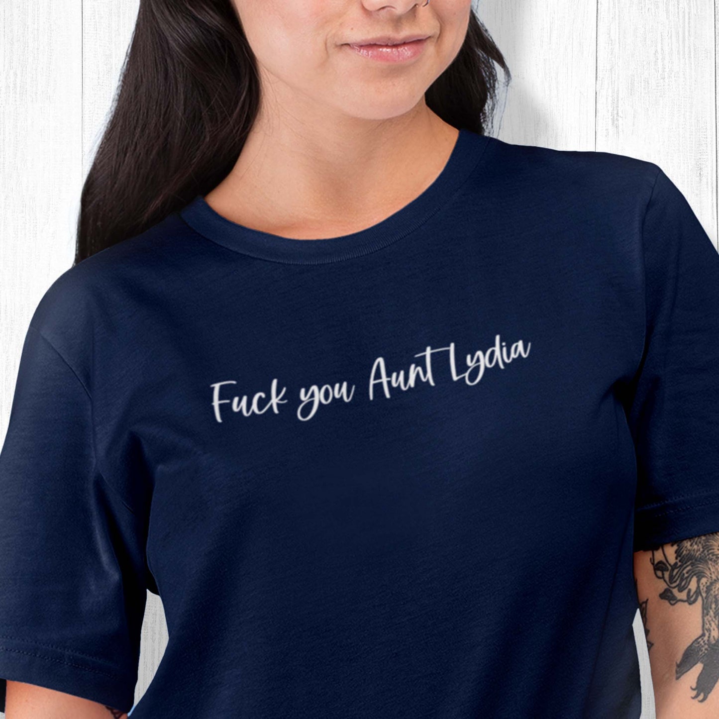 Navy Blue unisex t-shirt that says, “Fuck you, Aunt Lydia” in a script font.