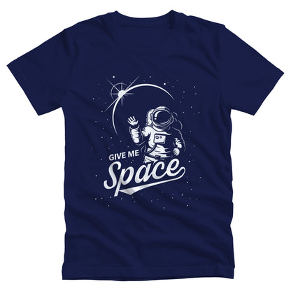 Navy Blue unisex t-shirt that says, “Give me Space” in a retro font. The text is slightly sheared upwards with an illustration of an astronaut and the mood integrated in on the right side.