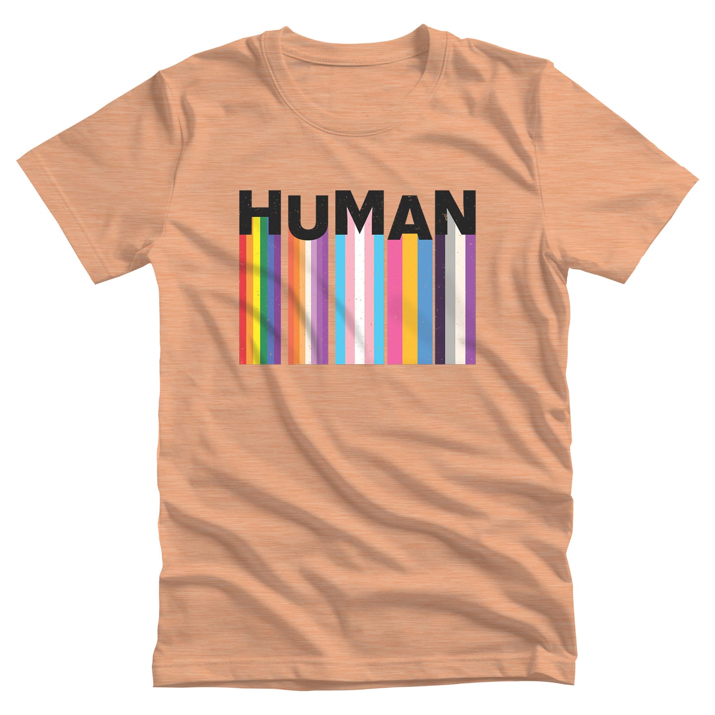 Heather Peach color unisex t-shirt with a colorful and dynamic image featuring the word "HUMAN" written in an artistic style. Each letter is arranged to create a wavy pattern. There are stripes of colors coming down from the bottom of each letter representing different sexualities in the LGBTQ+ community. The "H" represents Gay, the "U" represents Lesbian, the "M" represents Trans, the "A" represents Pansexual, and the "N" represents Asexual.