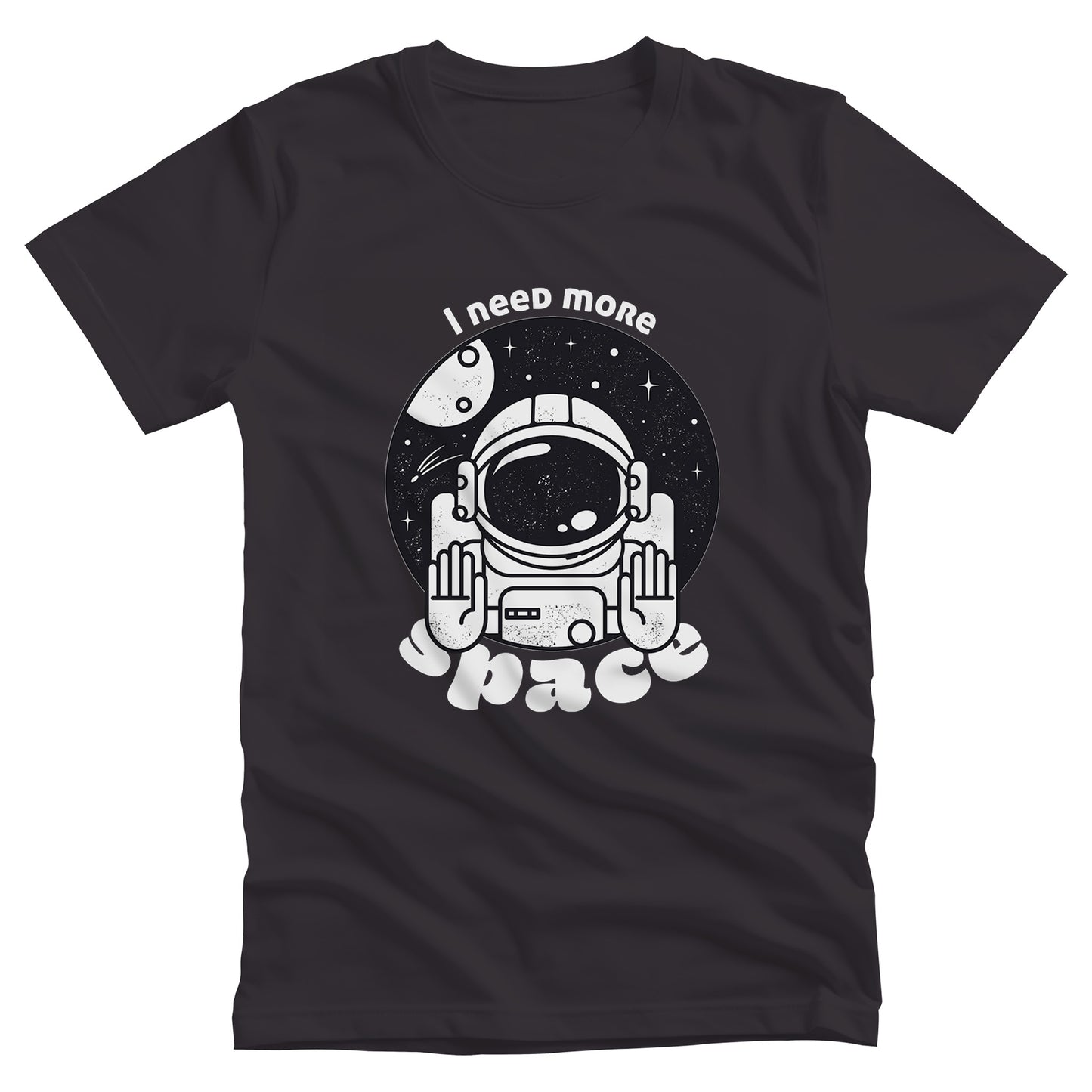 Dark Grey unisex t-shirt that says, “I need more space”. The text is a retro font. There is a graphic of an astronaut inside a circle with their hands in the stop position. “I need more” is arched over the graphic, and “space” is reverse-arched over the bottom of the graphic.