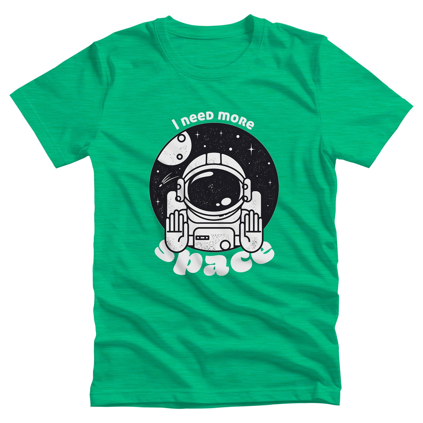 Heather Kelly color unisex t-shirt that says, “I need more space”. The text is a retro font. There is a graphic of an astronaut inside a circle with their hands in the stop position. “I need more” is arched over the graphic, and “space” is reverse-arched over the bottom of the graphic.