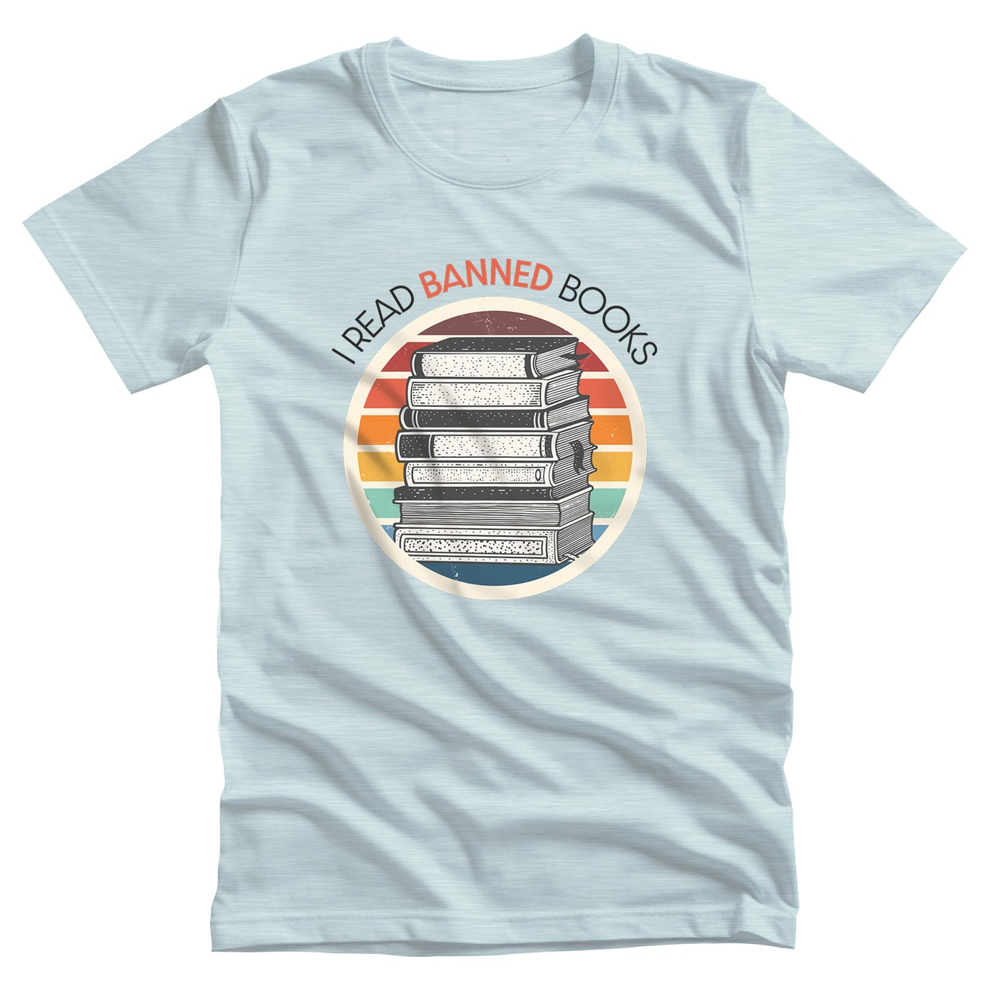 Heather Ice Blue color unisex t-shirt with a circular graphic of stacked old books with a vintage sunset made from horizontal lines behind it. “I READ BANNED BOOKS” is arched over the graphic with the word. “BANNED” an orange color.