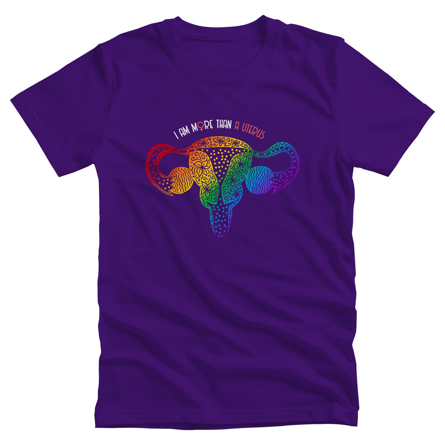Team Purple color unisex t-shirt that says, “I am More Than a Uterus” in all caps. The “O” in “more” is the symbol for the female gender. The text is arched slightly over an illustration of a uterus made from swirls and flowers in a rainbow-gradient color.