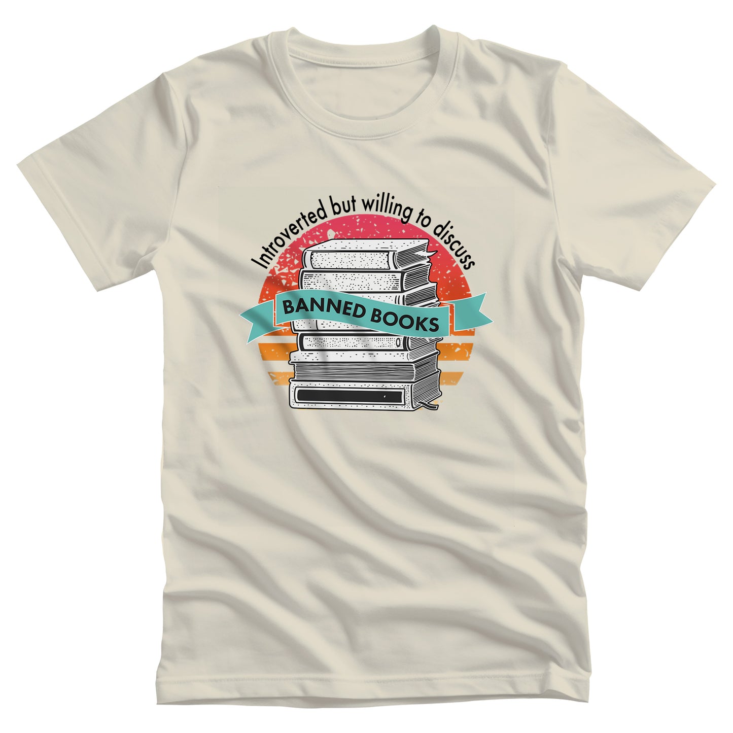 Natural color unisex t-shirt with a graphic that says, “Introverted but willing to discuss banned books.” The image has stacked books with a circular retro sunset behind it. “Introverted but willing to discuss” is arched over the graphic, and “banned books” is inside a wavey blue-green colored ribbon.