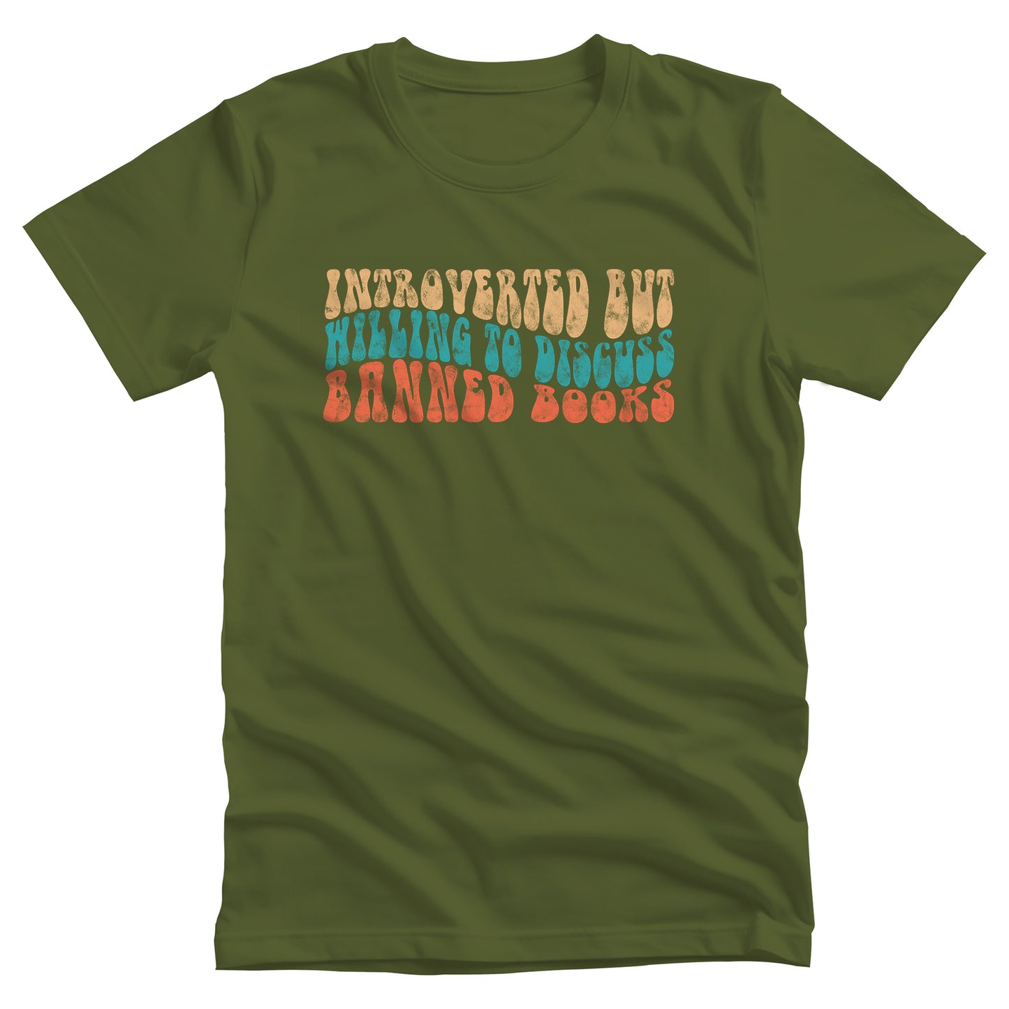 Olive color unisex t-shirt with a graphic that says “Introverted but willing to discuss banned books” in a retro, 1970s bubble font. Each line is a different color. The graphic is slightly distressed.