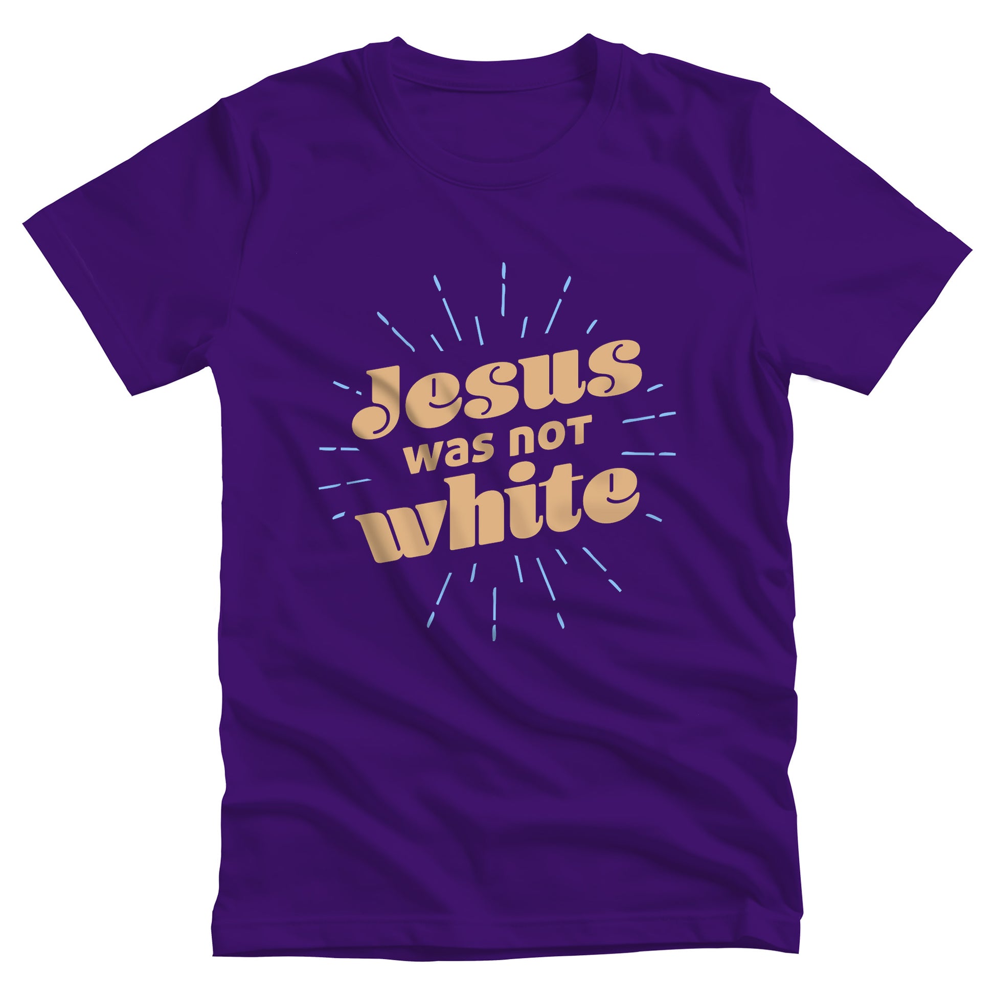 Team Purple color unisex t-shirt that says, “Jesus was not white” in over a blue-green starburst. The text is thick, has curls, and is slanted upwards.