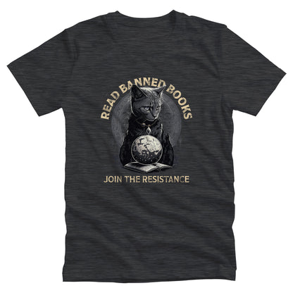 Dark Grey Heather color unisex t-shirt with a graphic of a cat sitting over a globe and an open book. The text says “Read banned books” arched over the top of the cat and “Join the resistance” in a line under the graphic. The text is in all caps.