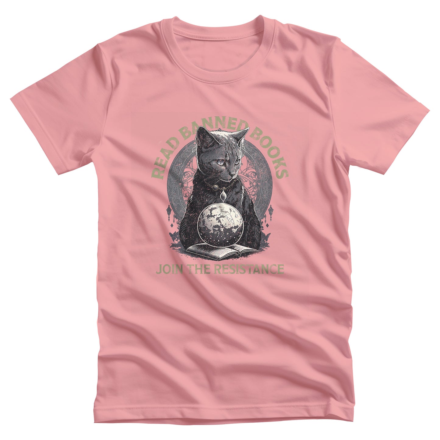 Pink unisex t-shirt with a graphic of a cat sitting over a globe and an open book. The text says “Read banned books” arched over the top of the cat and “Join the resistance” in a line under the graphic. The text is in all caps.