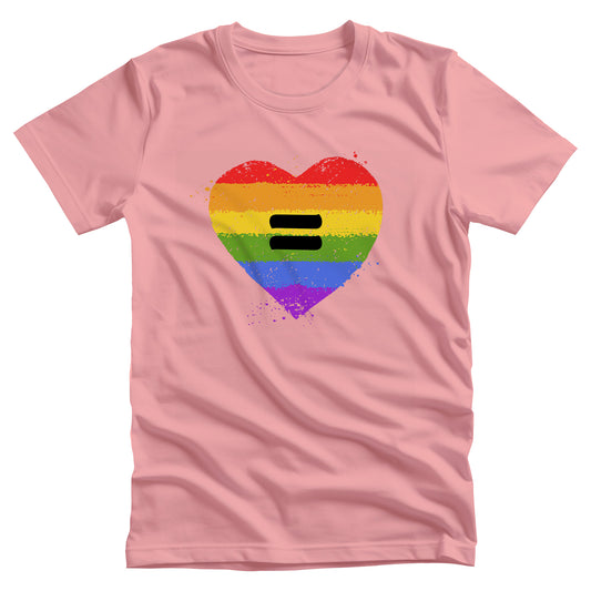 Pink color unisex t-shirt with a graphic of a rainbow heart with a black equal sight in the middle. The heart has small rainbow-color pain splatters around it. 