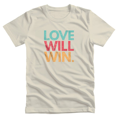 Natural color t-shirt with a graphic that says “Love will win.” in all caps. Each word is on its own line and is a different color. “Love” is greenish-blue, “Will” is red, and “Win.” is yellow. The graphic has a faded and slightly grungy/worn look.