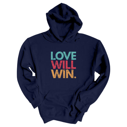 Navy Blue hoodie with a graphic that says “Love will win.” in all caps. Each word is on its own line and is a different color. “Love” is greenish-blue, “Will” is red, and “Win.” is yellow. The graphic has a faded and slightly grungy/worn look.