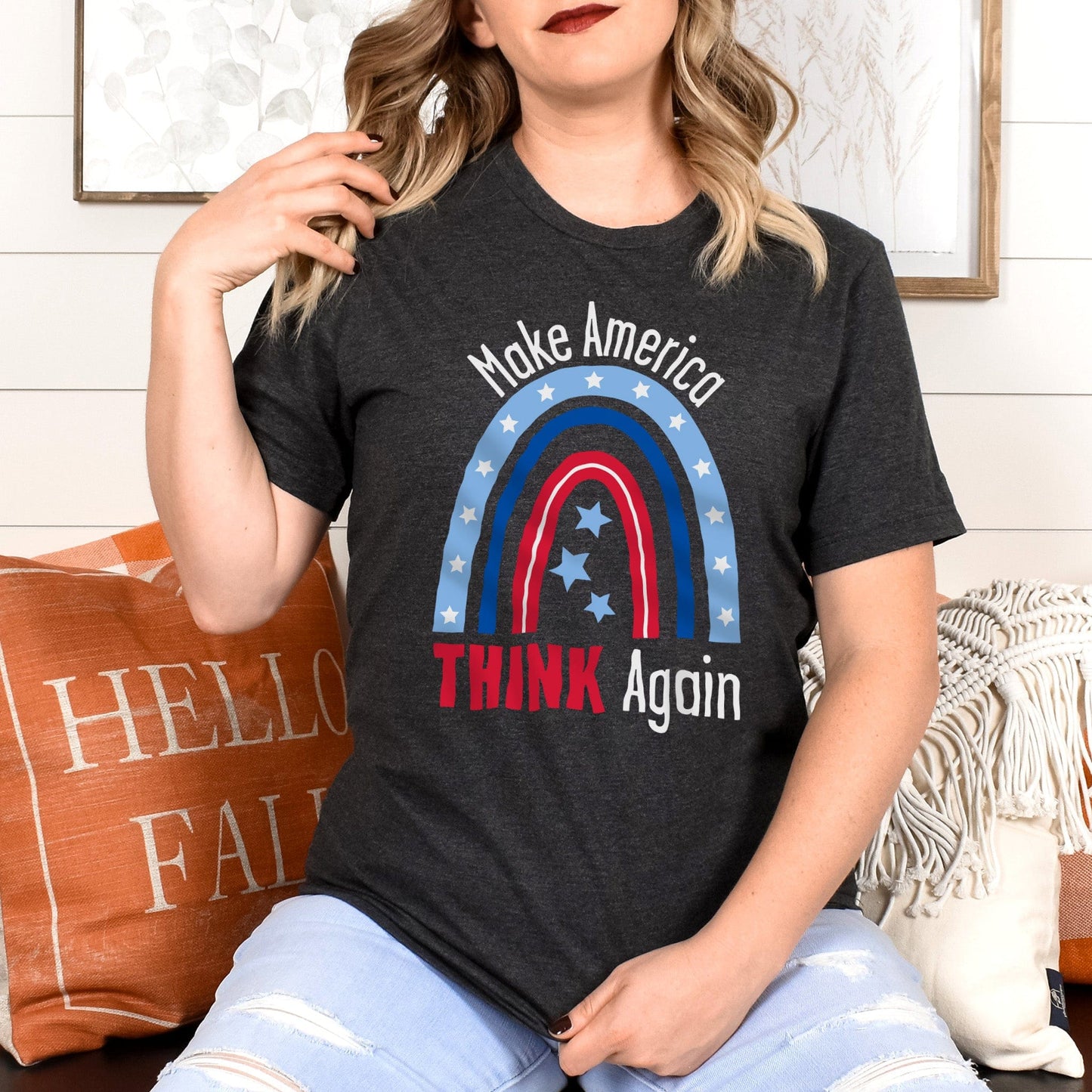 Dark Grey Heather color unisex t-shirt that says, “Make America THINK Again” with a graphic of a blue and red rainbow. “Make America” is red and arched over the rainbow. “THINK Again” is beneath the rainbow with “THINK” being blue and “Again” being red.