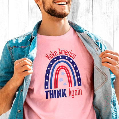 Pink unisex t-shirt that says, “Make America THINK Again” with a graphic of a blue and red rainbow. “Make America” is red and arched over the rainbow. “THINK Again” is beneath the rainbow with “THINK” being blue and “Again” being red.