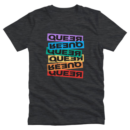 Dark Grey Heather color unisex t-shirt artistically expresses the word “Queer.” Each variation of the word is black text in a rectangular block and stacked vertically at a slightly different angle than the next row/block. Sometimes “Queer” is backward, sometimes upside down, and sometimes 1-2 letters are backward. The color blocks are purple, blue, green, yellow, and red.