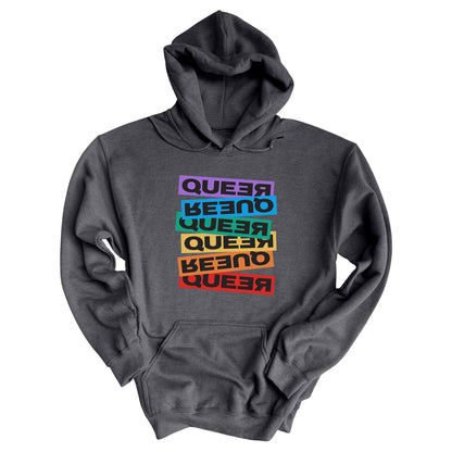 Dark Heather color unisex hoodie artistically expresses the word “Queer.” Each variation of the word is black text in a rectangular block and stacked vertically at a slightly different angle than the next row/block. Sometimes “Queer” is backward, sometimes upside down, and sometimes 1-2 letters are backward. The color blocks are purple, blue, green, yellow, and red.