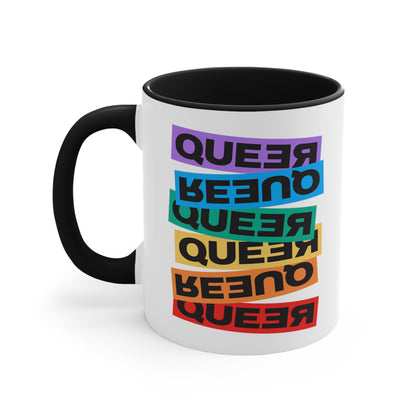 11oz ceramic mug with a black handle and interior. This mug artistically expresses the word “Queer.” Each variation of the word is black text in a rectangular block and stacked vertically at a slightly different angle than the next row/block. Sometimes “Queer” is backward, sometimes upside down, and sometimes 1-2 letters are backward. The color blocks are purple, blue, green, yellow, and red.